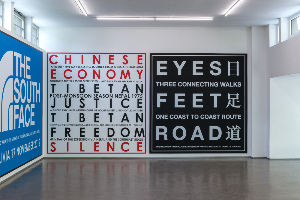 Exhibition view; NATURE AS COMMUNITIES; NOT COMMODITIES, Hamish Fulton,; Gallery Stadtpark Krems, 2026; Photo: Stefan Lux; Chinese Economy. Nepal 1995 2009.; Wall painting, vinyl lettering, variable size; Eyes Feet Road. Japan. 1986 1989 1990.; Wall painting, vinyl lettering, variable size; Courtesy and © Hamish Fulton